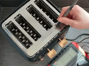 Morphy Richards four-slot toaster being tested with an earth probe.