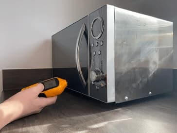 Microwave emissions testings Portable appliance radiation test of a microwave.